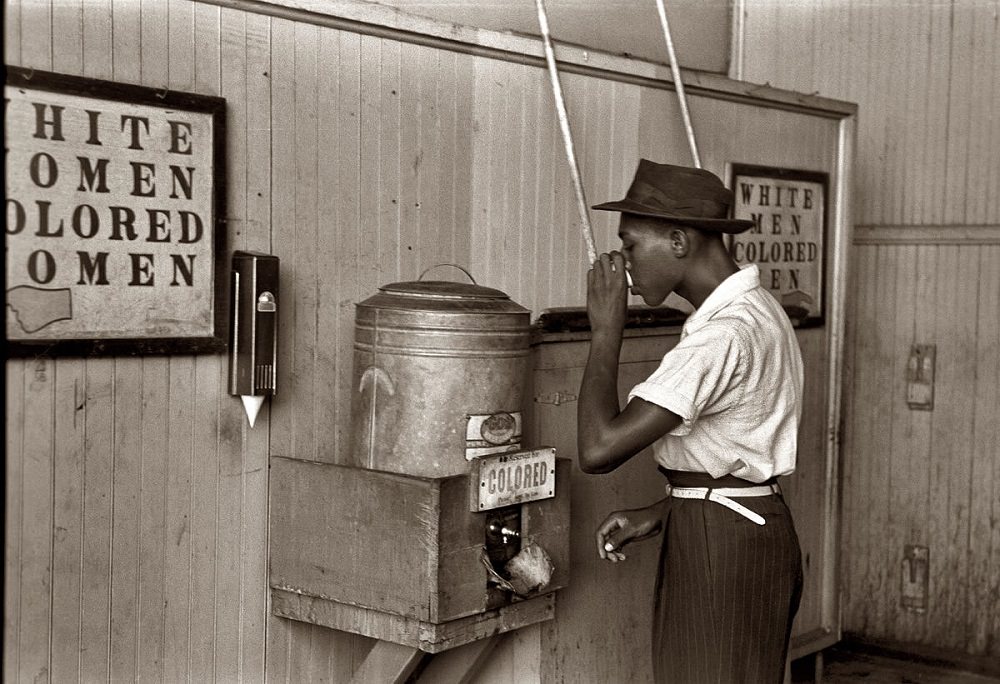 #54 Negro drinking at ‘colored’ water cooler in Oklahoma City streetcar terminal, July 1939