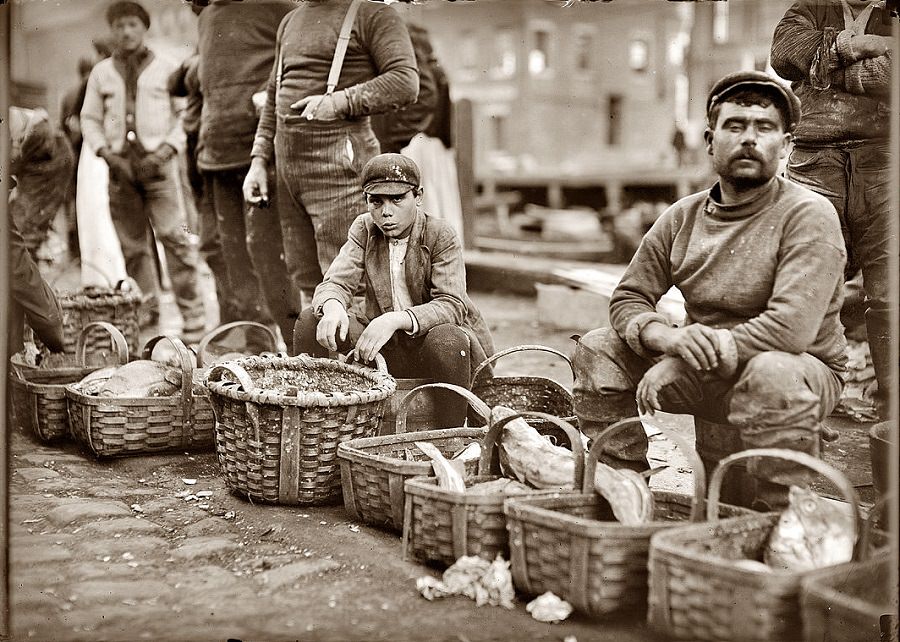 #71 Boy selling fish from a basket in Boston street market, October 1909