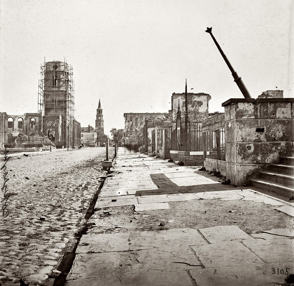 #65 Meeting Street, looking south, showing St. Michael’s Church, the Mills house and ruins of the Circular Church, 1865