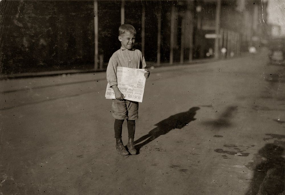 #17 Young newsboy who begins work at daybreak, Mobile, Alabama, October 1914