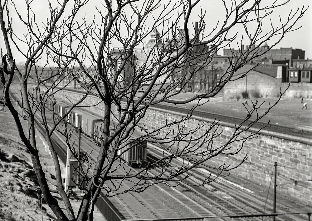 #42 Reading Railroad tracks with an abandoned brewery in the background, Pennsylvania, Spring 1938