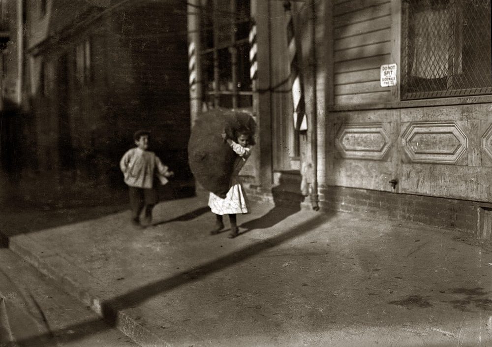#12 Spruce Street, Tiny girl with big bag she is carrying home, Providence, Rhode Island, November 1912