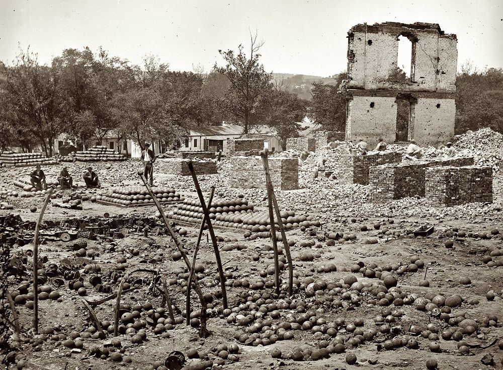 #32 Ruins of the State Arsenal at Richmond showing stacked and scattered ammunition, April 1865