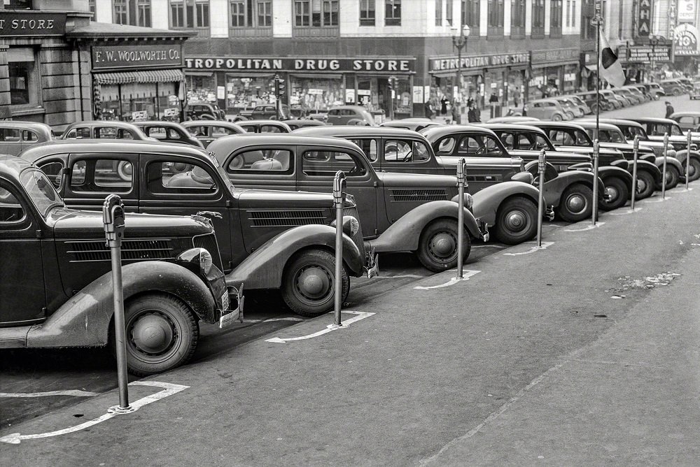 #12 Cars parked diagonally along a row of parking meters, Omaha, Nebraska, November 1938