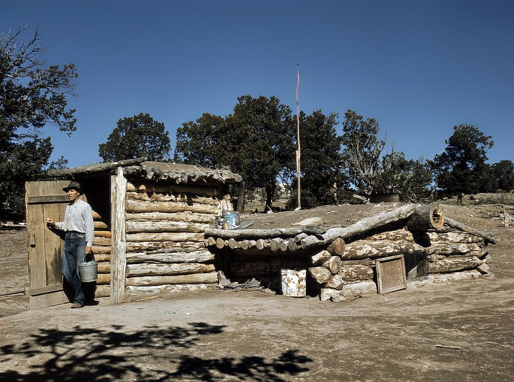 #25 Mr. Leatherman coming out of his dugout home at Pie Town, New Mexico, October 1940