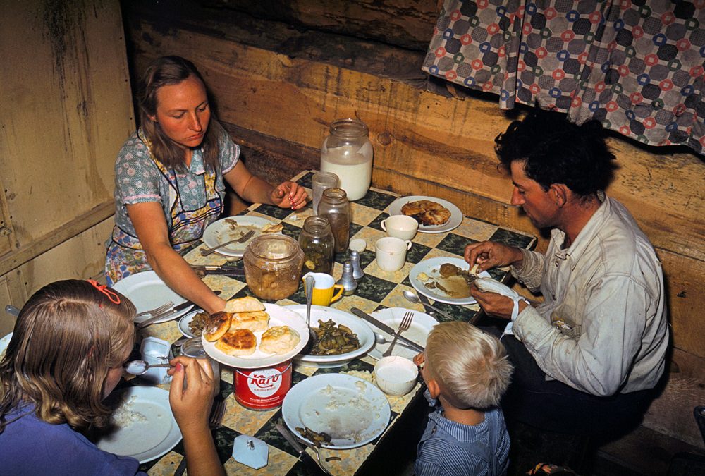 #27 The Faro Caudill family eating dinner in their dugout, Pie Town, New Mexico, October 1940
