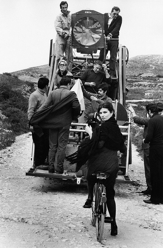 Scilla Gabel sitting on a bicycle on the set of the TV serial ‘Vino e Pane’, 1972