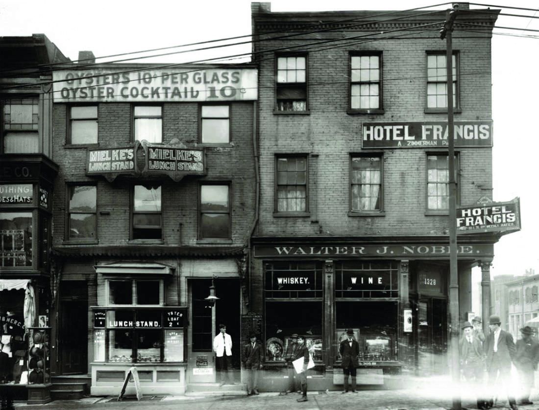 #60 Southeast corner of Market and Fourteenth streets including Mielke’s Lunch Stand, Hotel Francis and Walter J. Noble Whiskey and Wine, 1900