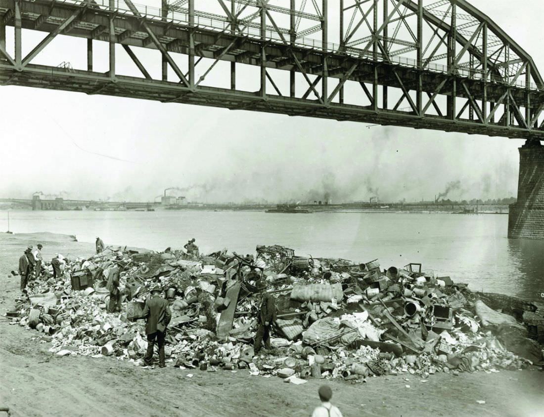 #66 Men going through a rubbish pile on the riverfront south of Municipal Free Bridge, 1910