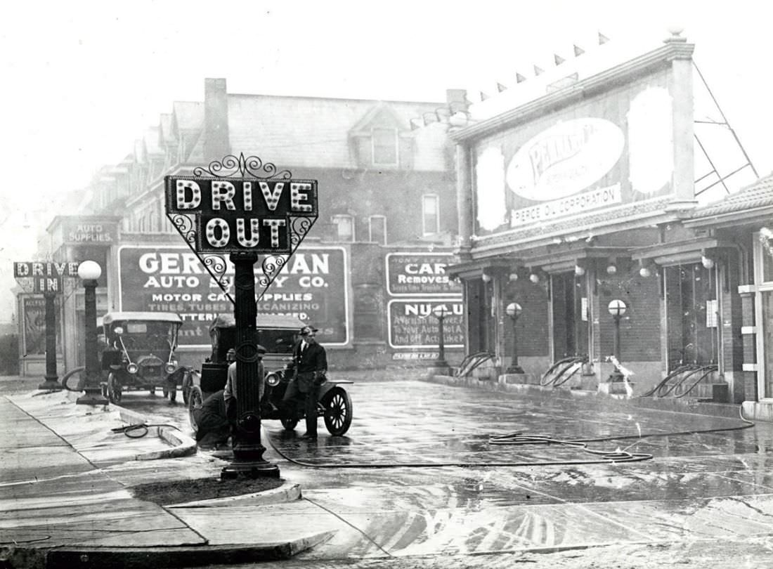 #29 Automobile fueling at one of the first gas stations in St. Louis, operated by the Pierce Oil Company at 4614 Washington Boulevard, 1916