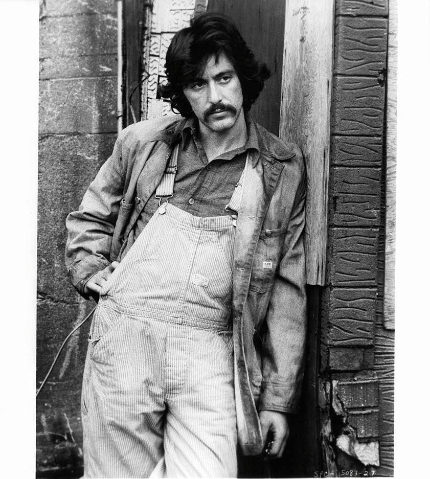Al Pacino leans against a building in a scene from the film ‘Serpico’, 1973