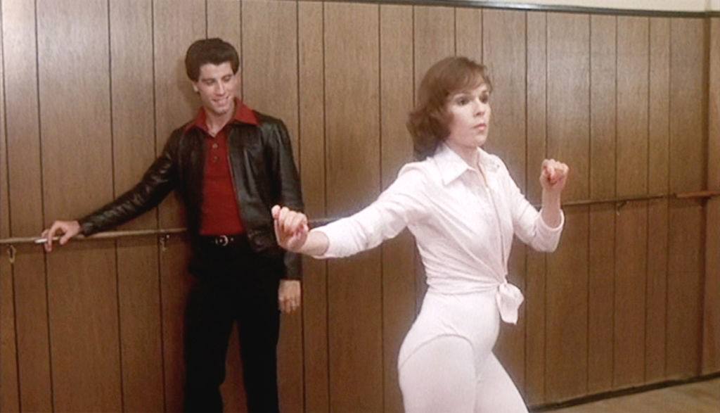 John Travolta watching Karen Lynn Gorney’s moves, 1977