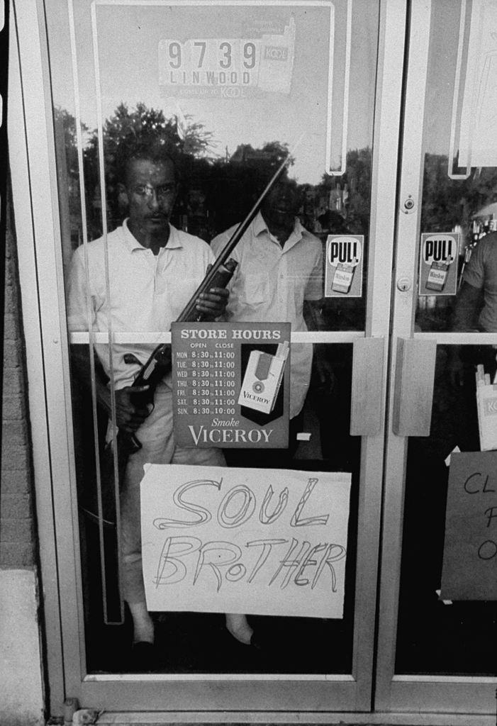 #13 Soul Brother sign indicating African American ownership to store to keep looters away during Detroit race riots, 1967
