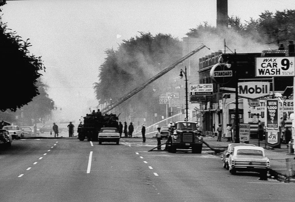 #18 During race riots in Detroit, showing devastated neighborhood, fireman fighting fire, 1967