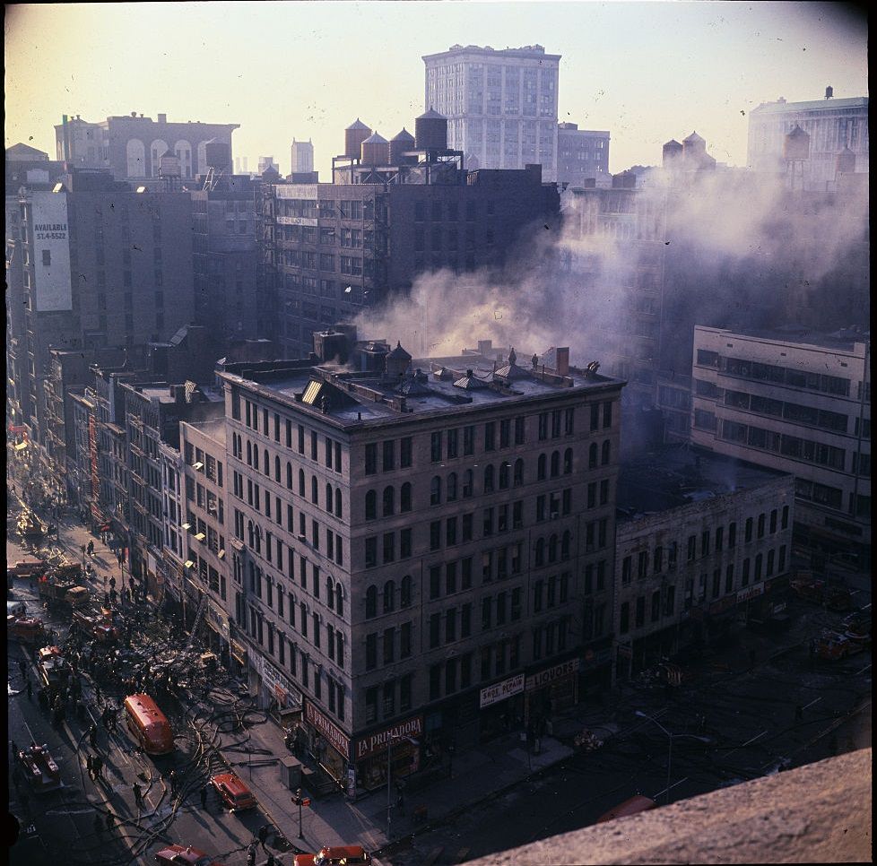 #35 Flames are seen here shooting from building as firemen hose down the structure, in Detroit, 1967