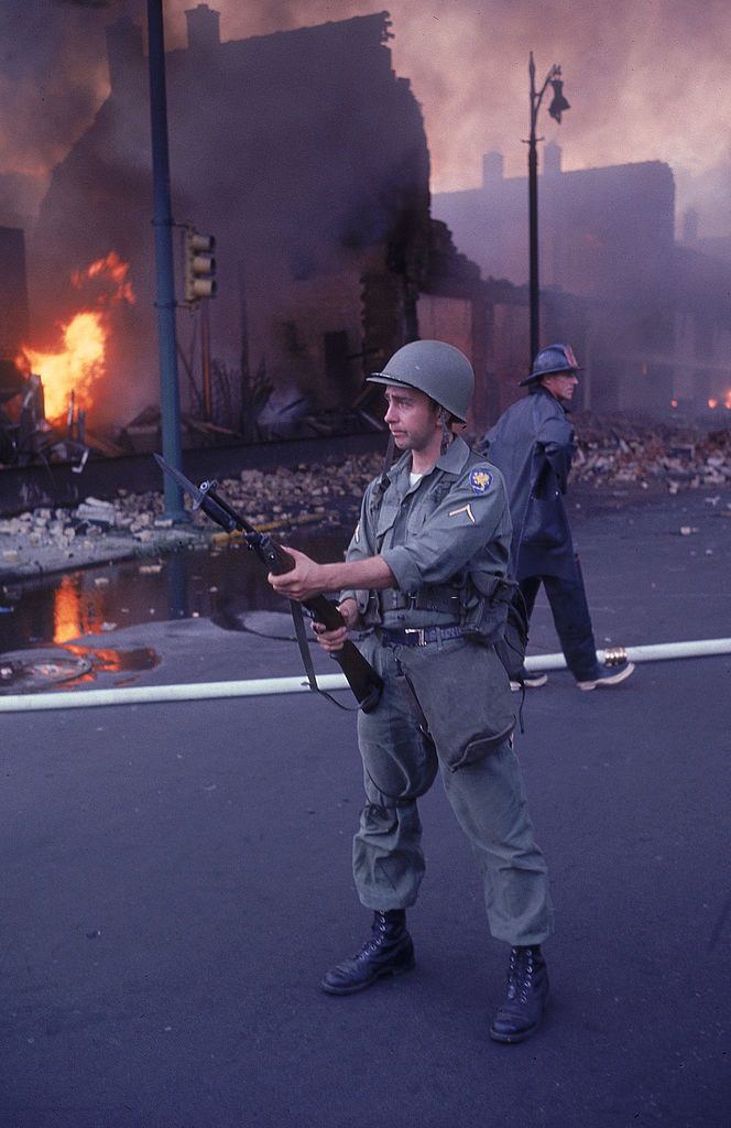 #5 National Guardsman patroling street after race riots, 1967