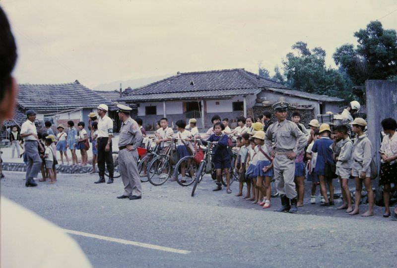 #23 Stopped for an air raid alert in a small village, Taichung, 1970s