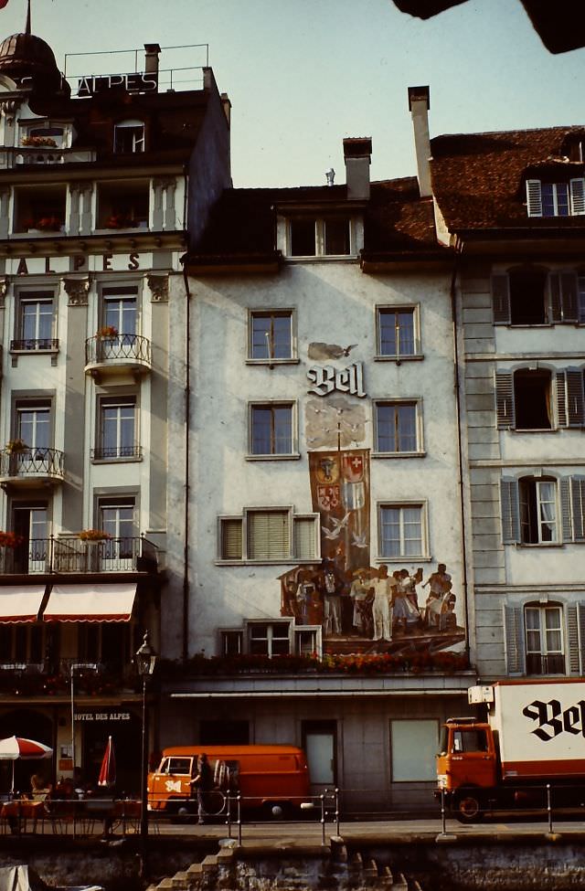 #22 Rathausquai with at the left Hotel des Alpes. Now the ‘Bell’ building is a part of the hotel, with a restaurant downstairs, Lucerne, Switzerland, 1980s