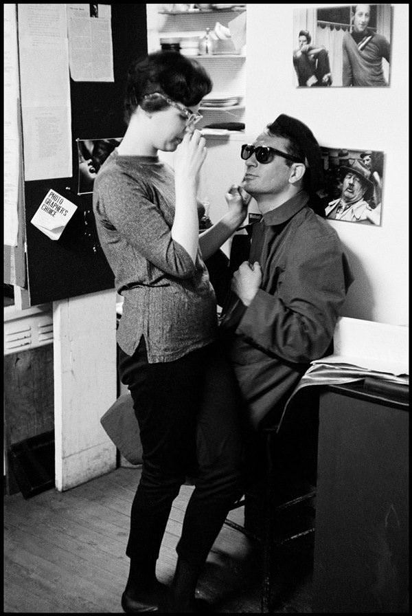 #21 Jack Kerouac talks to a friend at a Beat party.