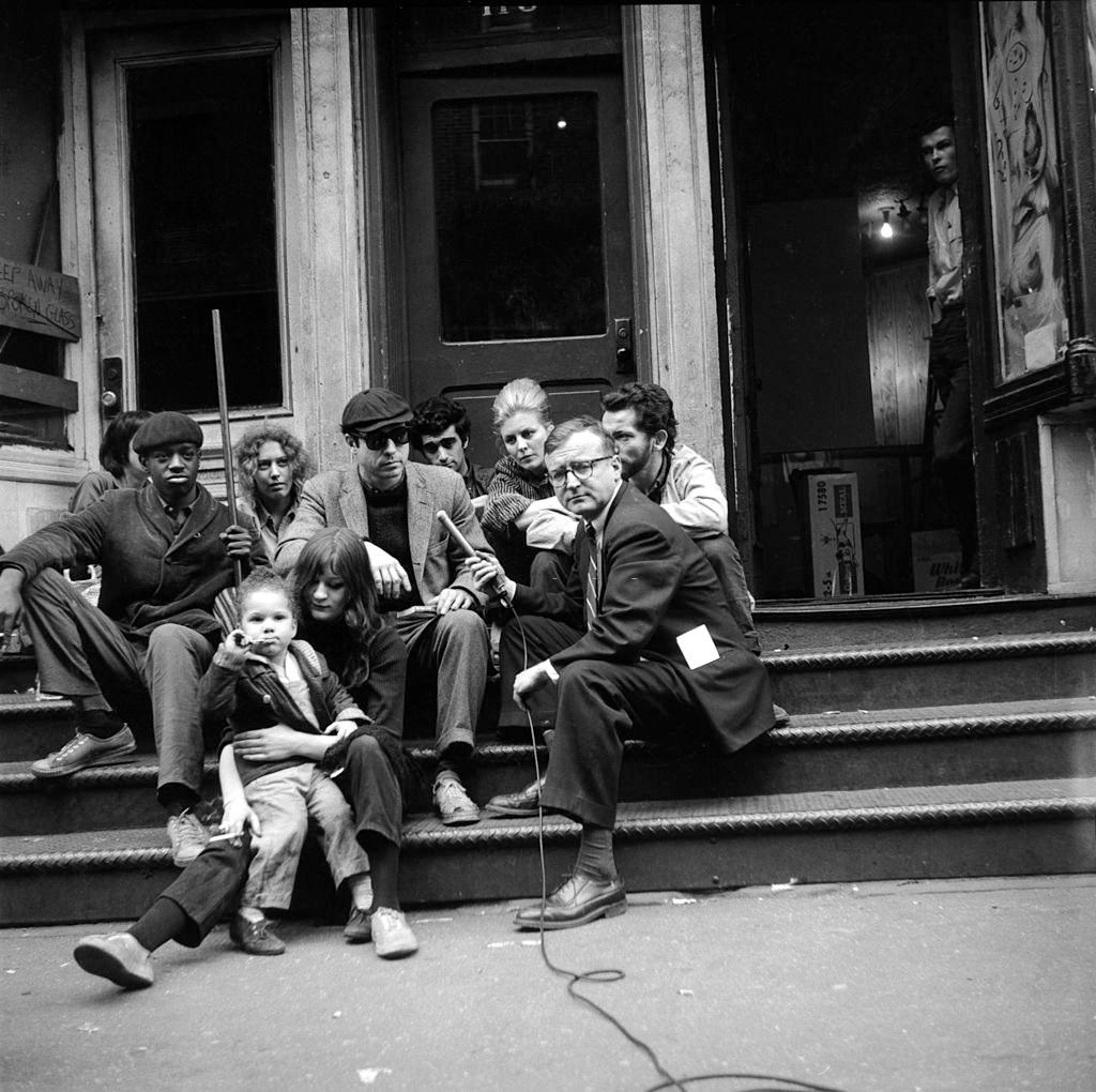 #8 Television journalist Danny Meenan interviewing Beatnik members, New York, 1960