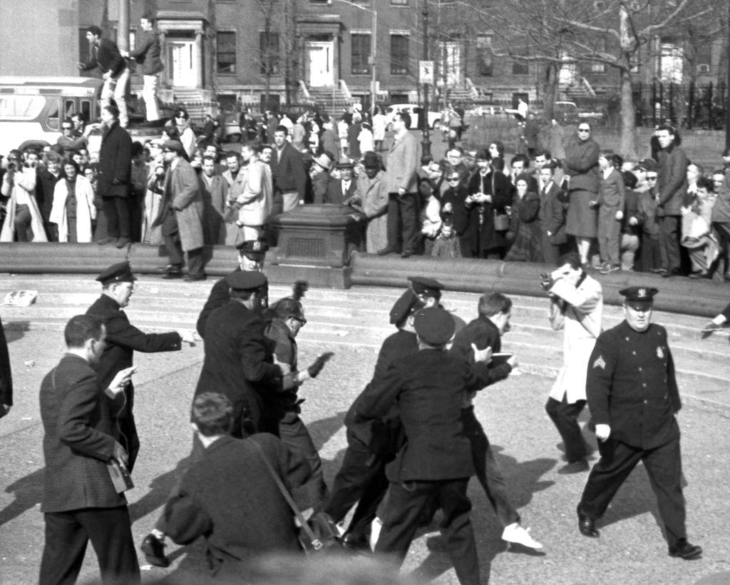 #47 Police officers arrest beatniks demonstrators in Washington Square Park during a march, April 9, 1961.