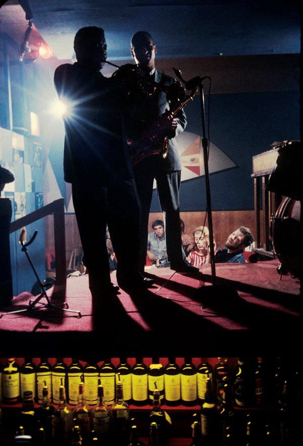 #13 A jazz bands plays from the top of a liquor cabinet at the Half Note nightclub, a regular hangout for the New York Beats, in 1959.
