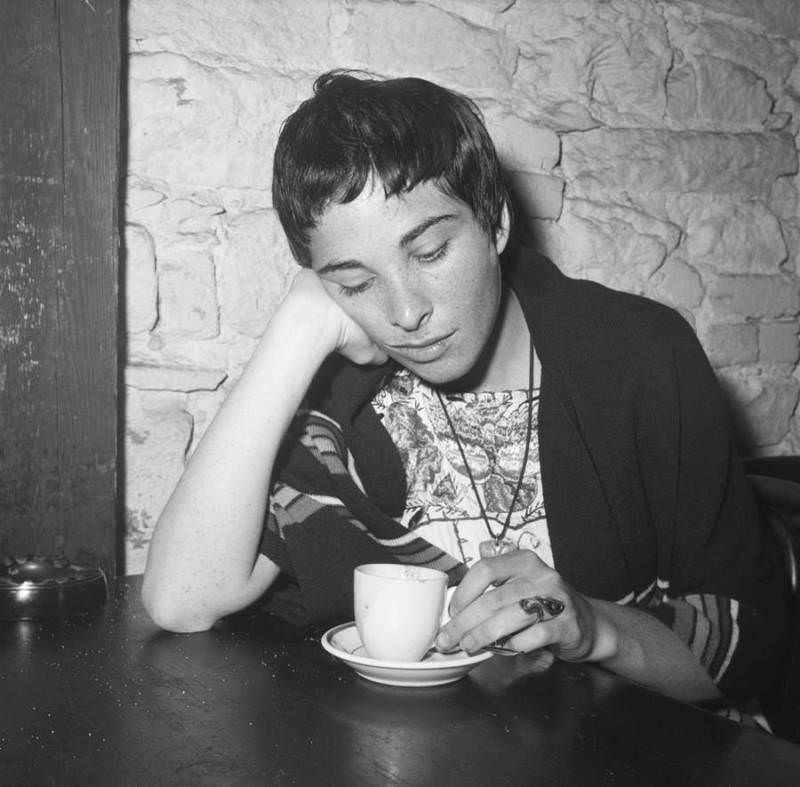 #19 A woman sits in contemplation while enjoying an espresso at Gaslight Cafe in 1959.