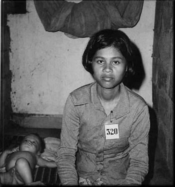 #13 A young girl with her baby in the prison.
