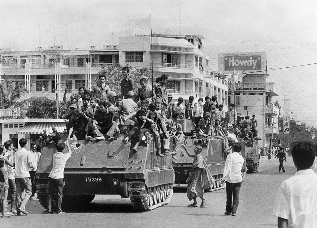 #41 The young Khmer Rouge guerrilla soldiers atop their US-made armored vehicles enter 17 April 1975 Phnom Penh