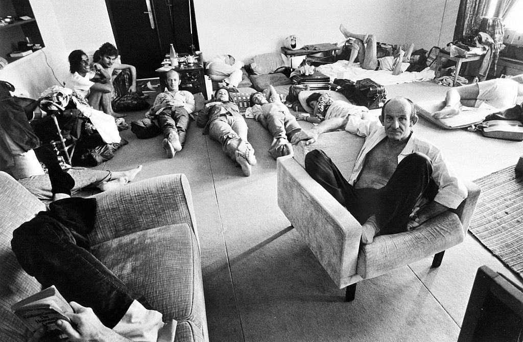 #42 People who found shelter at the French Embassy in Phnom Penh rest in one of the room of the building late April 1975