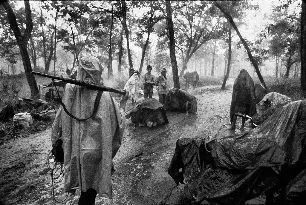 #44 Cambodian refugees and pro Sihanouk guerrilla along the Thai border during the rainy season before the Thai authorities and the UN could get the setup of camps to shelter them.