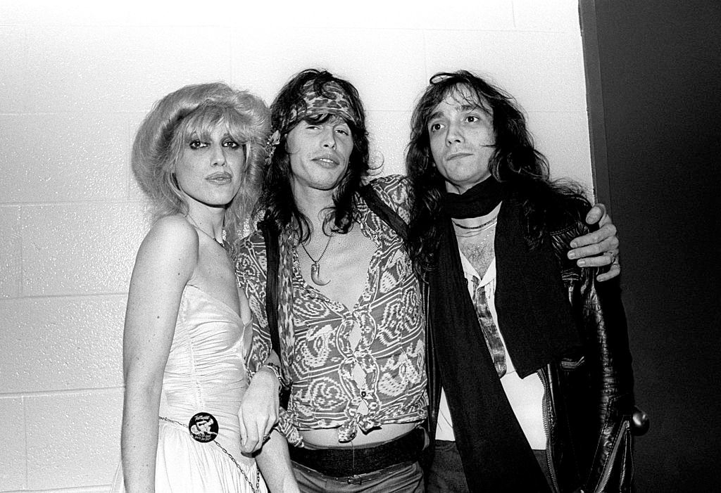 #22 Cyrinda Foxe with Jimmy Crespo and Steven Tyler at a Ted Nugent concert at the Meadowlands Arena in East Rutherford, 1981