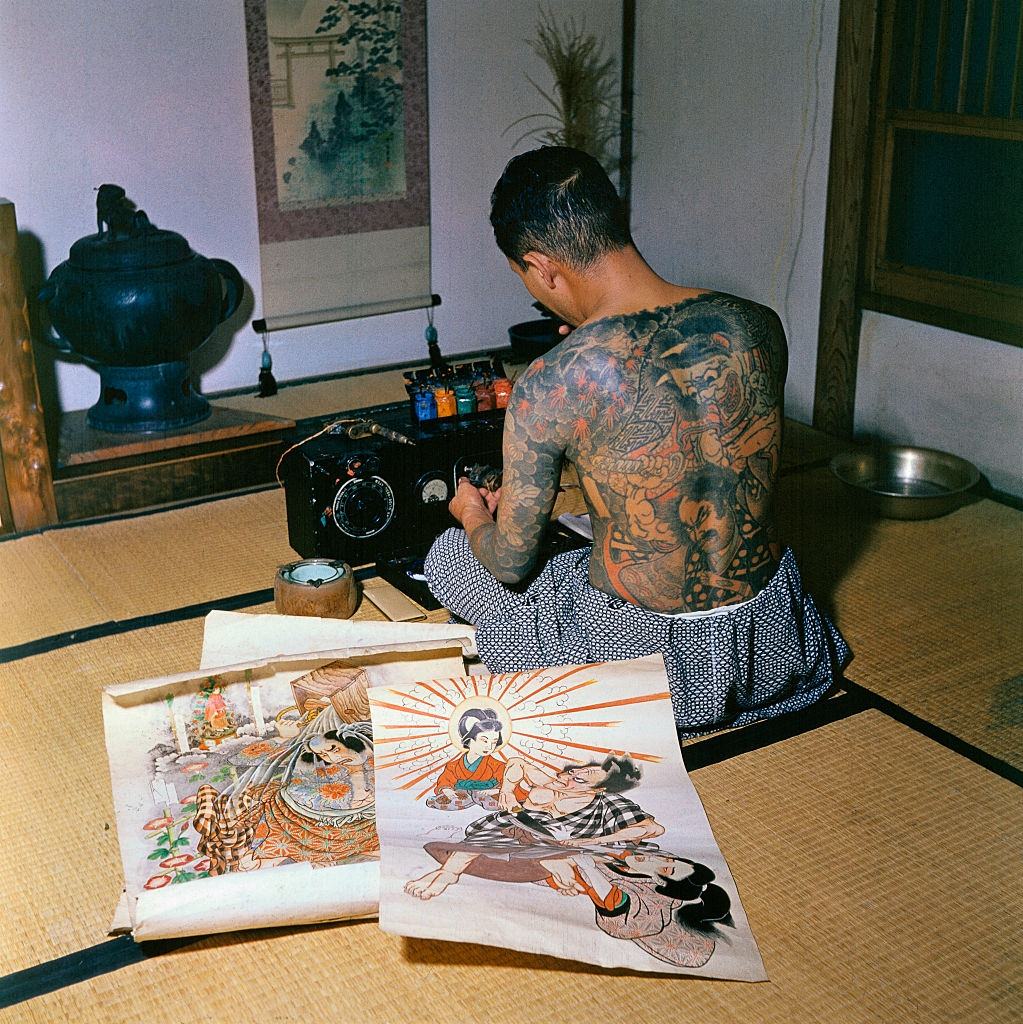#19 Japanese tattoo artist, Tokumitsu Uchida proudly displaying tattoo markings made by his father, Goro Uchida, who is considered the greatest of them all, 1955