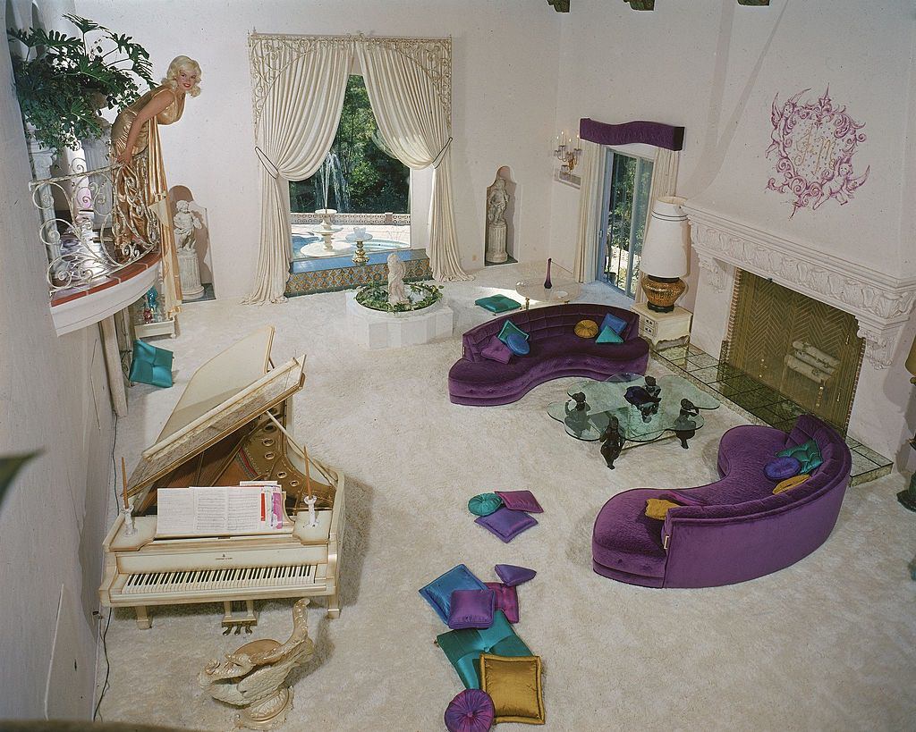 #10 Jayne Mansfield on balcony above the garish, shag carpet covered living room of her, Pink Palace, 1960s