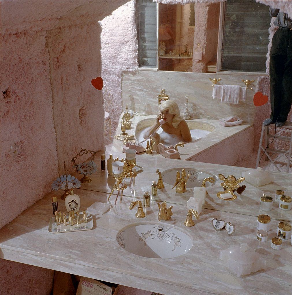 #9 Jayne Mansfield uses the telephone in her furry pink bathroom of Pink Palace, 1960s