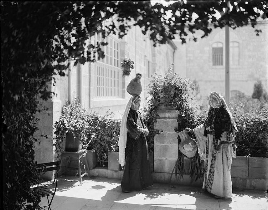 #17 Two women stop to talk.Ramallah, Circa 1898-1914