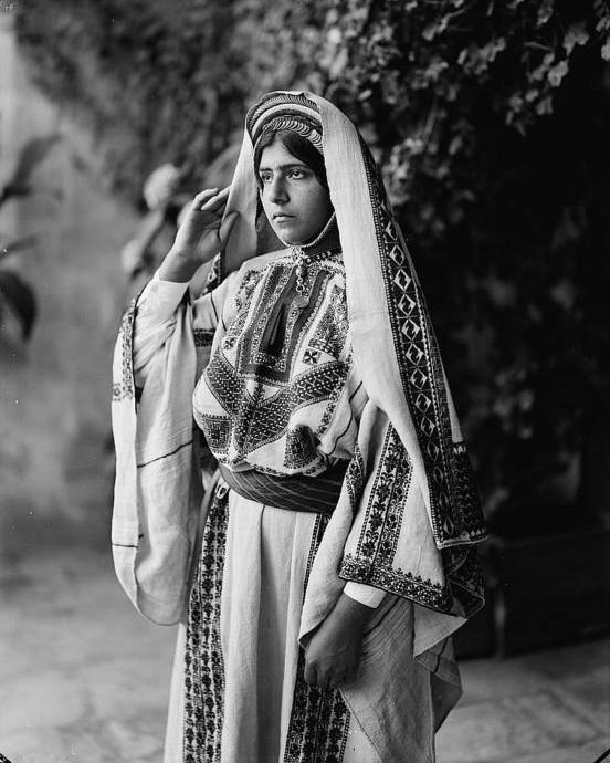 #24 A Ramallah woman in an embroidered dress.Ramallah, Circa 1940-1946.