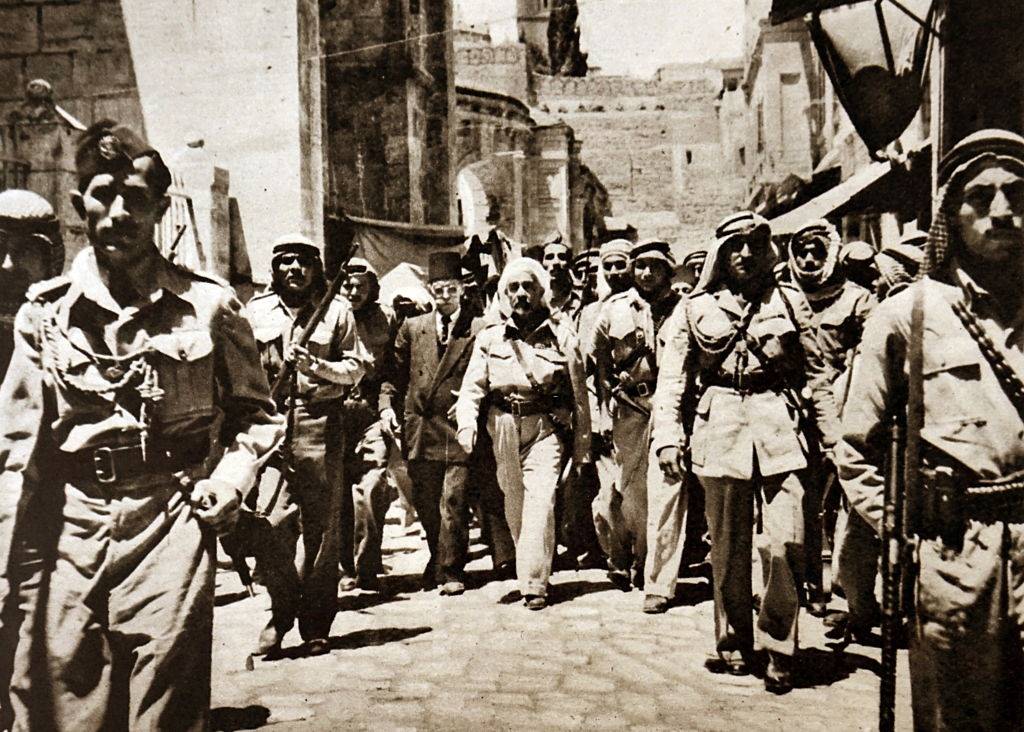 #11 King Abdullah I bin al-Hussein being escorted by members of the Arab Legion in Jerusalem, 1899