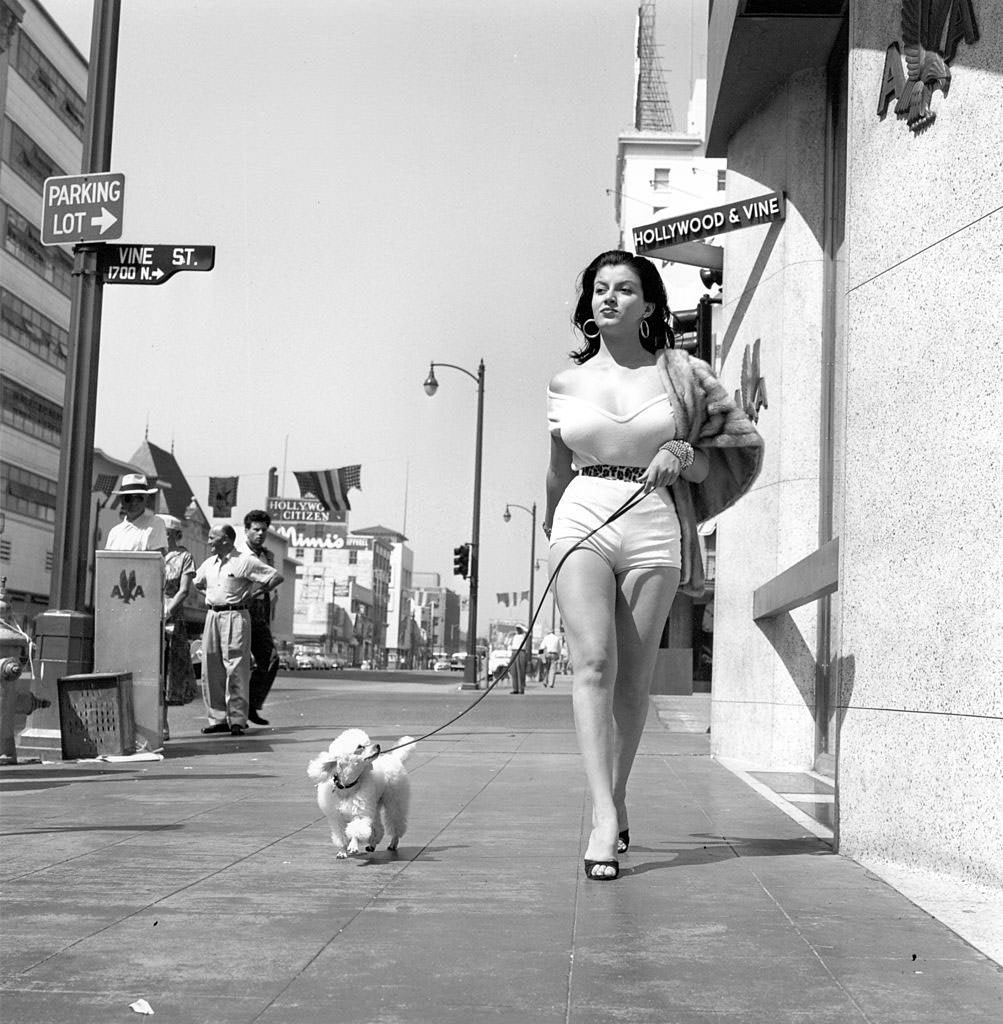 #1 Joan Bradshaw Walking on Hollywood Boulevard with her dog, 1957