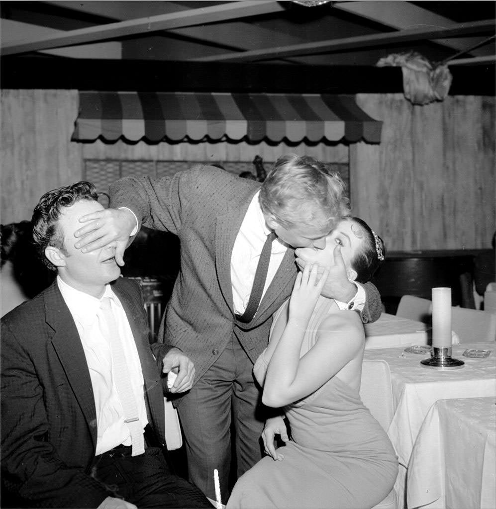 #12 A man kissing Joan Bradshaw, 1960