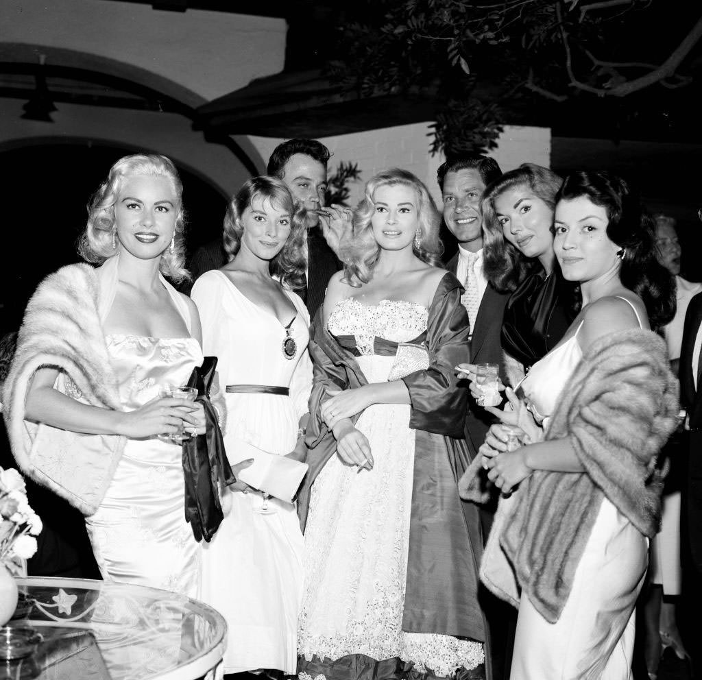 #17 Joan Bradshaw with Jeanne Carmen, Vikkie Dugan, Lance Fuller, Anita Ekberg, Anthony Steel and Joan Tyler at a party, 1957