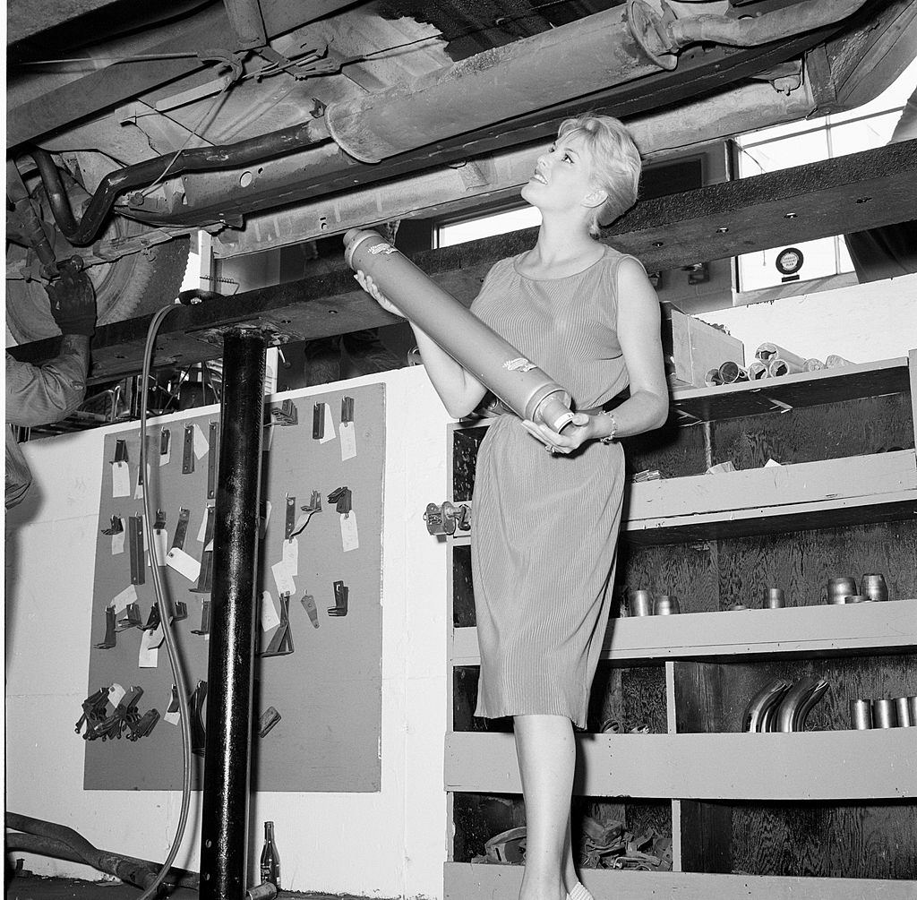 #12 June Wilkinson posing for a promotional shoot for Muffler, 1959