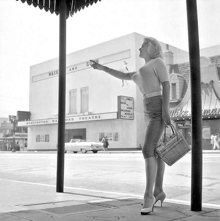#13 June Wilkinson in white shirt and bullet bra, 1958
