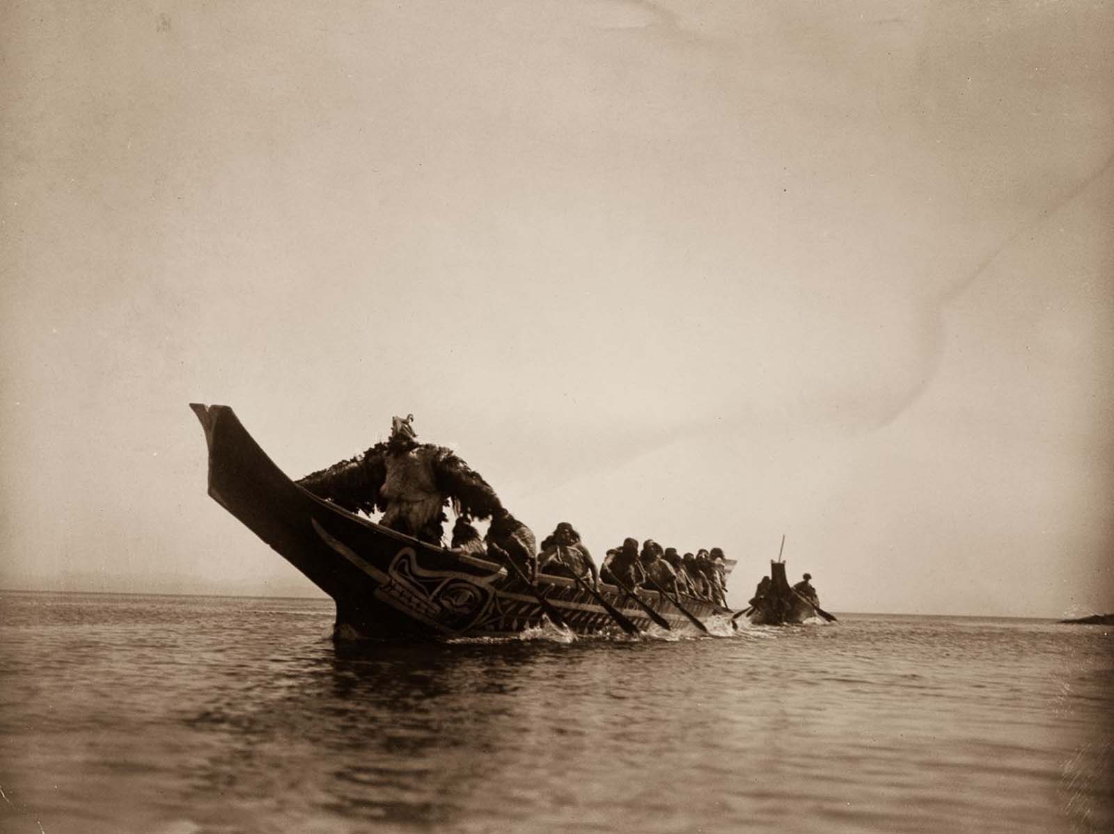 #20 Kwakiutl people in canoes in British Columbia. 1914.