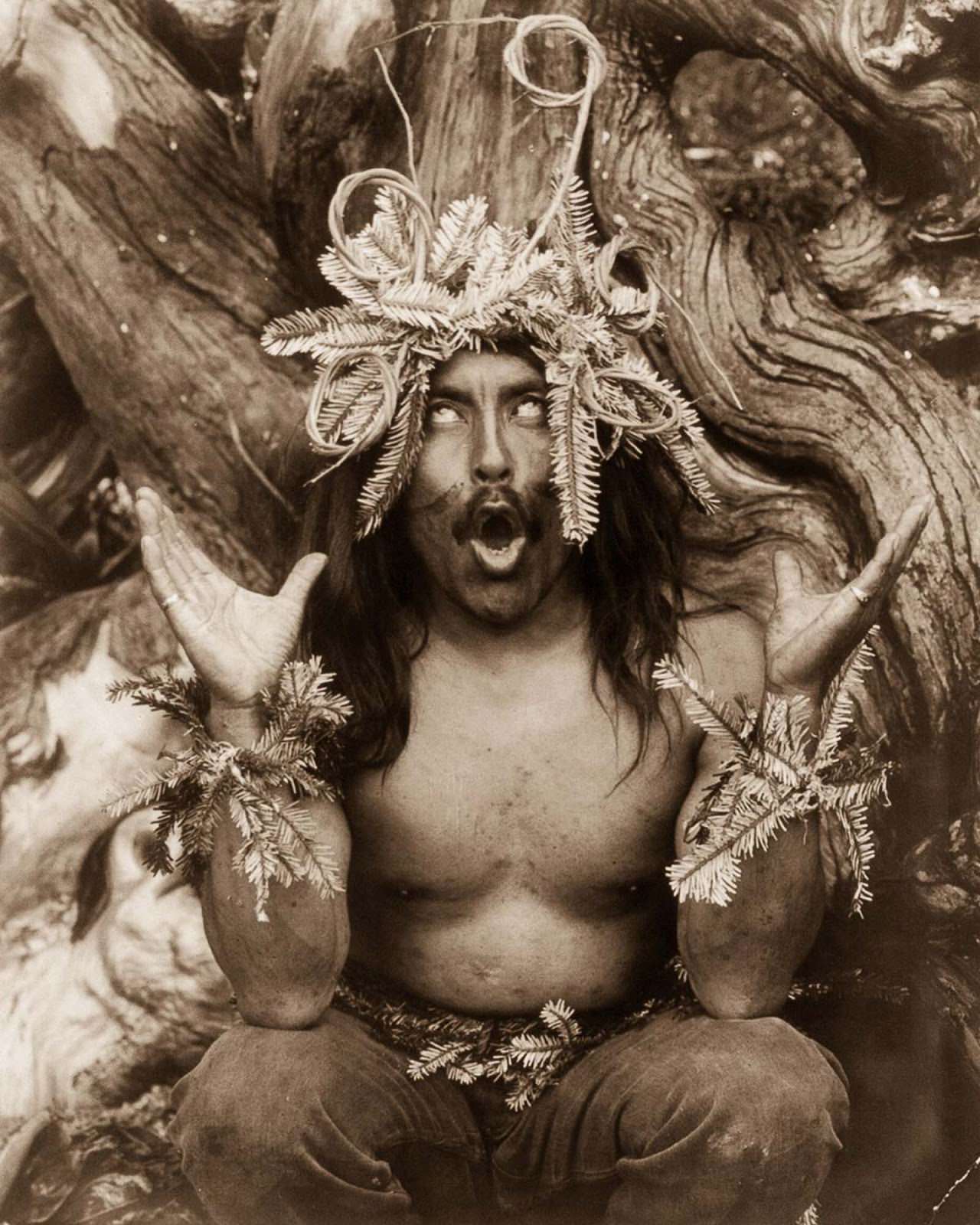 #21 A Kwakiutl shaman performs a religious ritual. 1914.