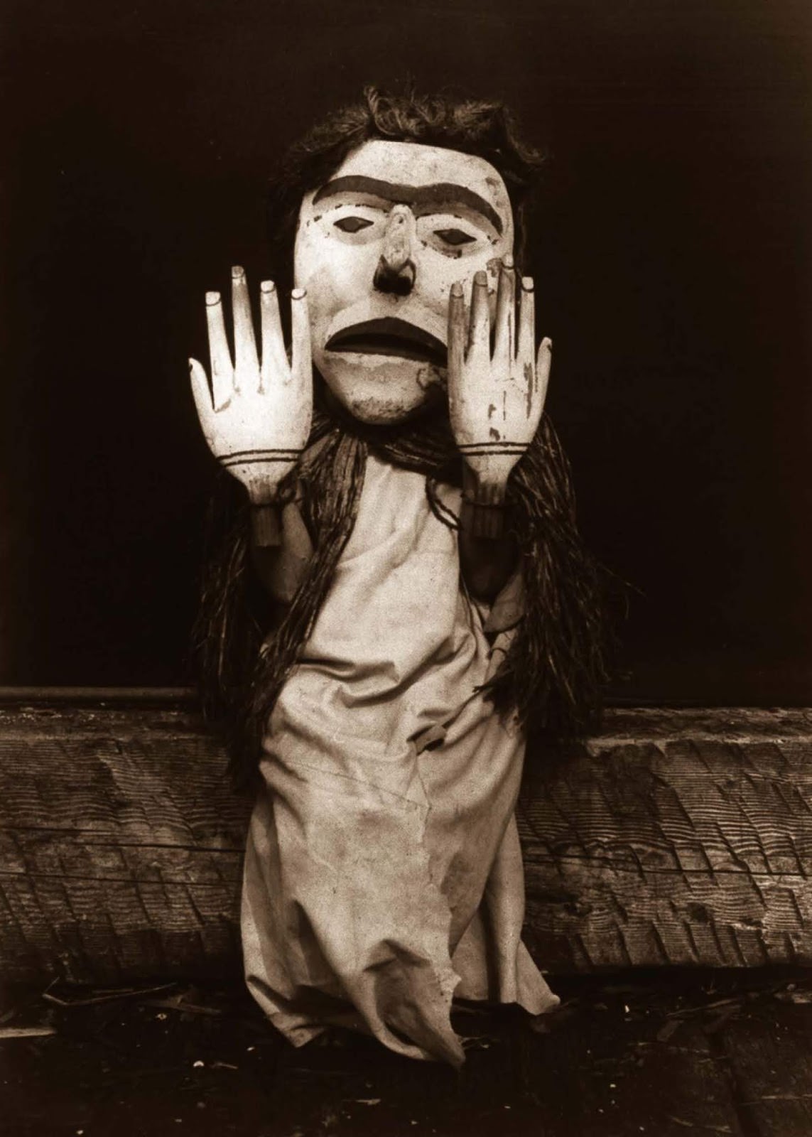 #42 A Kwakiutl person dressed as a forest spirit, Nuhlimkilaka, (“bringer of confusion”). 1914.