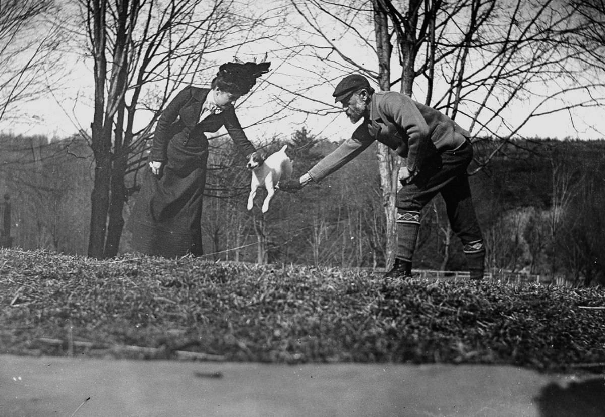 #20 Dr. Ernest Palmer and wife join hands to make a bar so that their dog can jump over it.April 15, 1900