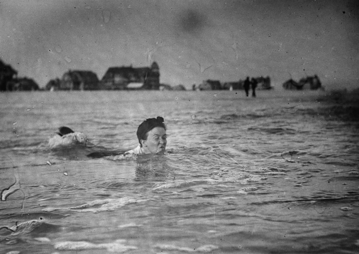 #29 A woman swims at the beach.Sept. 8, 1897