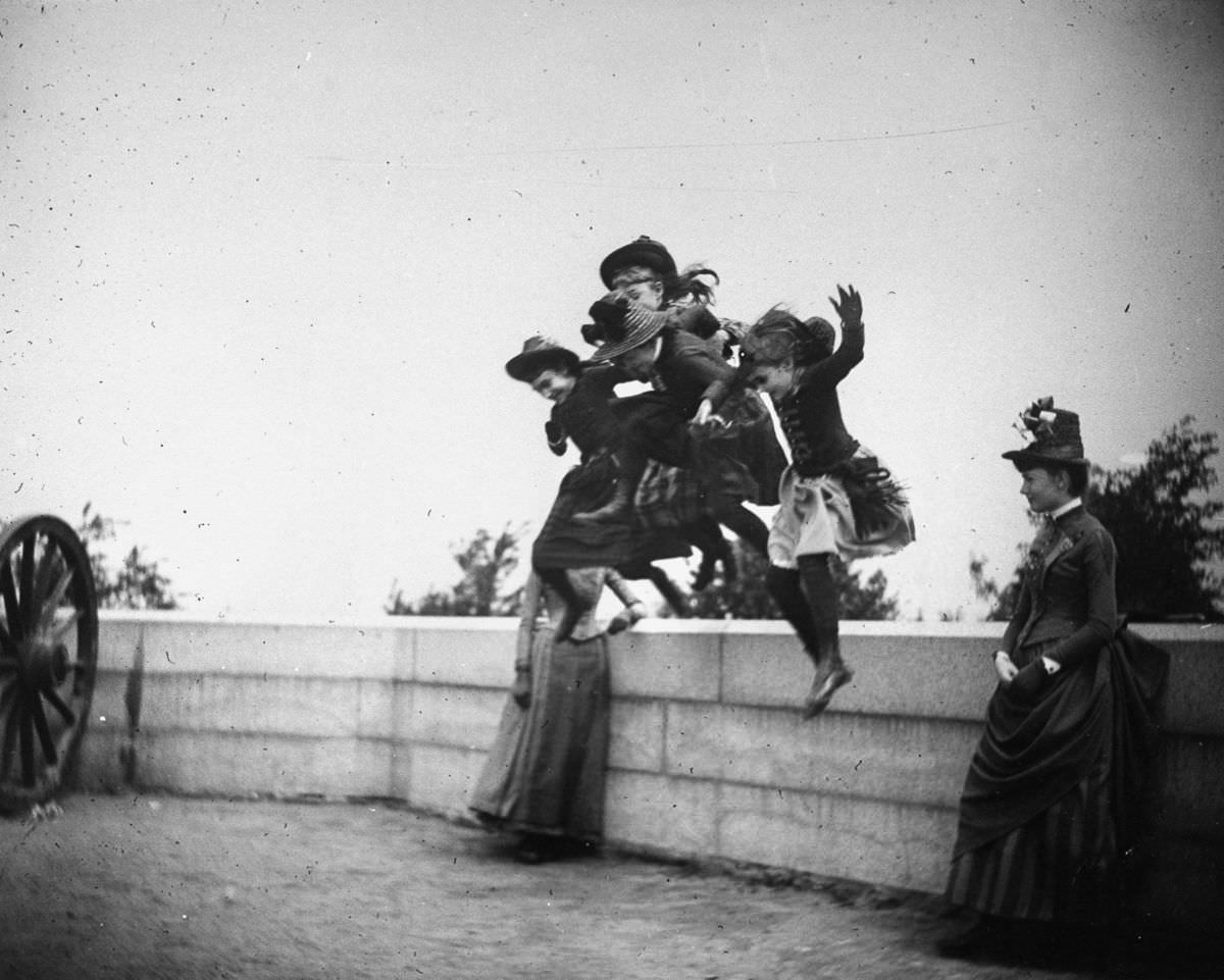 #5 Girls jump off a stone wall in Fort Greene.May 22, 1886