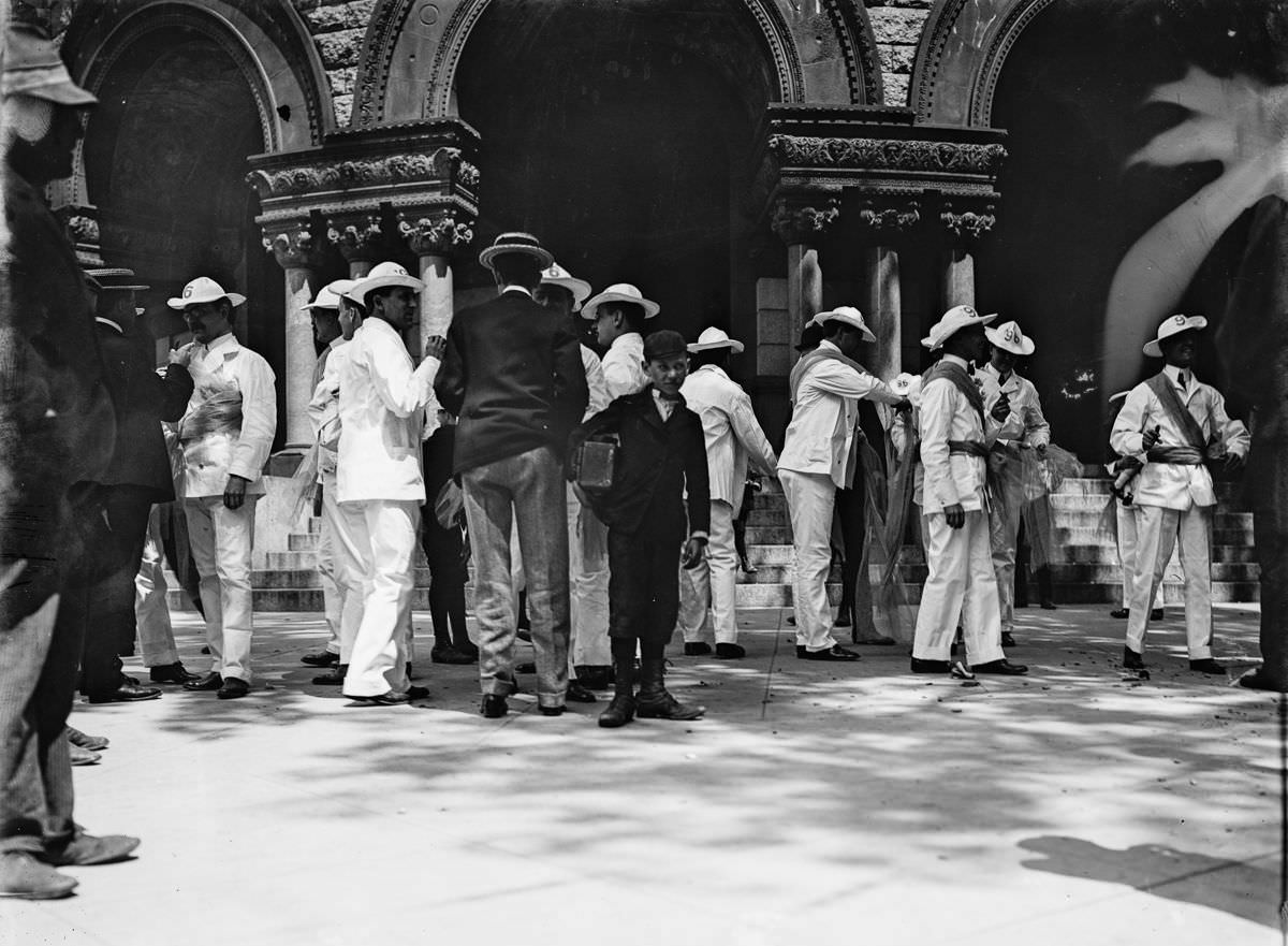 #22 A newsboy and soldiers in a plaza, Havana, 1900
